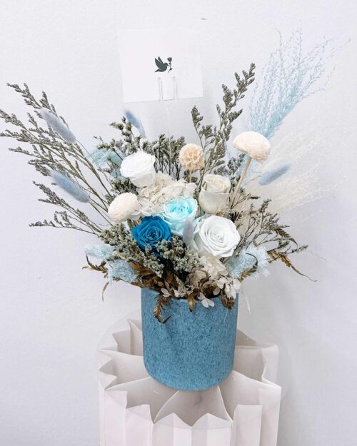Blue preserved flowers in a pot