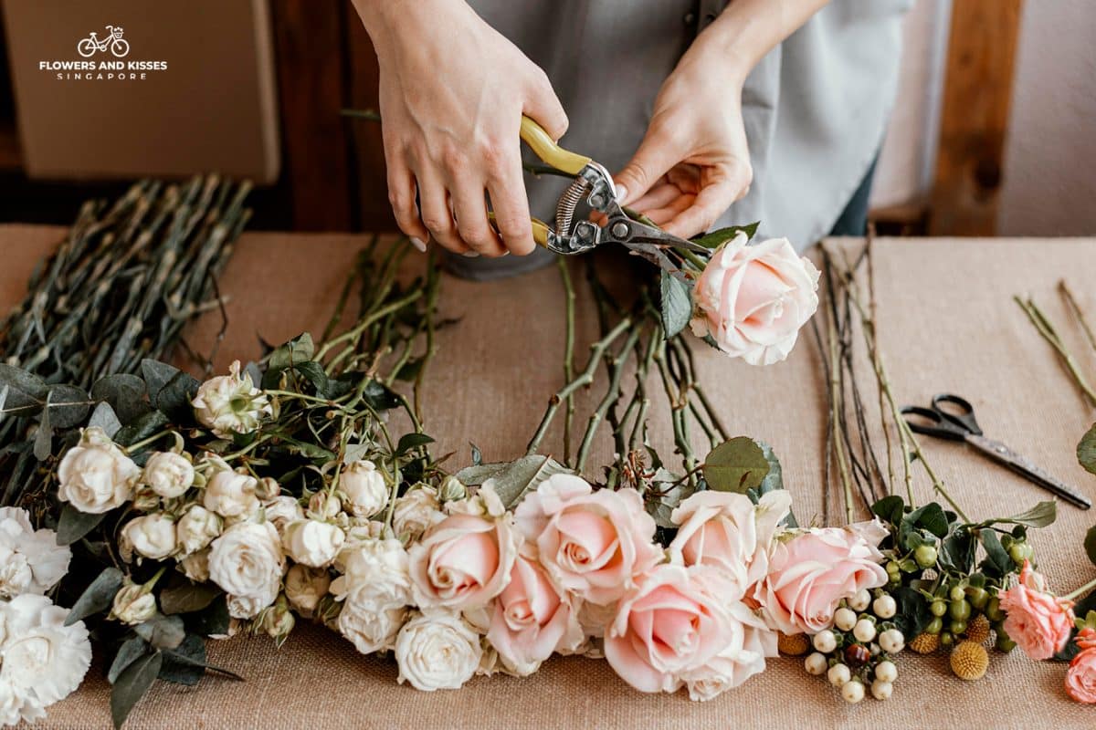 How To Arrange Flowers In A Vase Florist Cutting Stems For An Online Order