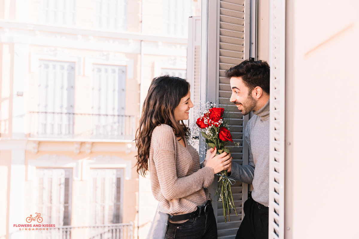5 Reasons To Send Your Loved One A Bouquet Of Flowers Today Male giving Flowers to his Girlfriend